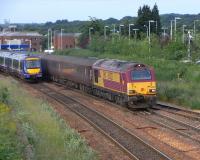 67 023 restarts from Kirkcaldy on 23 June with its morning Inner <br>
Circle service to Edinburgh via Dunfermline. Going the other way is a pair of class 170s, forming the 0727 to Edinburgh via the coast. The scenery's nicer via the latter route, but which train would you rather be on? <br>
<br><br>[David Panton 23/06/2010]