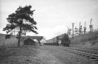 A southbound passenger train headed by a Black 5 on the Settle & Carlisle line around 1964/65, possibly the 4.37pm Carlisle - Bradford stopping service. The train is just over 3 miles north of Armathwaite having just passed below the bridge carrying the Wetherall - Armathwaite road. It will shortly pass the site of the former Cotehill station (closed 1952).<br><br>[Robin Barbour Collection (Courtesy Bruce McCartney) //]