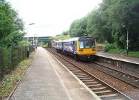 A thwarted attempt at a <I>Then and Now</I> comparison with a 1968 picture of Hindley [See image 27035] due to the lifted slow lines being fenced off and overgrown. The semaphore signals have been replaced by colour lights but these are controlled from the nearby Crow Nest Junction mechanical box. 142012 is on a Wigan to Manchester service in this view looking west towards Wigan.<br><br>[Mark Bartlett 09/07/2010]