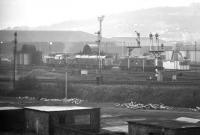 Looking north across the E&G towards Haymarket shed in 1972, photographed from the abandoned embankment that carried the Caledonian line between Dalry Middle Junction [see image 29480] and Haymarket West Junction (closed 1964). Nearest the camera is the spur from Haymarket Central Junction, just off picture to the right, connecting with the 'sub' at Gorgie Junction. The vantage point used here is now occupied by the Murrayfield link of the Western Approach Road.<br>
<br><br>[Bill Jamieson //1972]