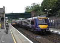 Edinburgh (left) and Glasgow services pass at Polmont on 15 June 2010.<br><br>[David Panton 15/6/2010]