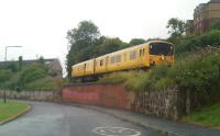 A Network Rail inspection unit on its way back to Inverkeithing along the Rosyth Dockyard branch on 10 July 2010, seen here shortly after passing the derelict Caldwells Paper Mill.<br><br>[Grant Robertson 10/07/2010]