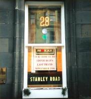 Back in November 1996 a display in the window of a solicitors' office in Bruntsfield commemorates the 40th anniversary of Edinburgh's last tram (or last moving tram, we'd have to say in July 2010) with some memorabilia. The 28 was indeed the last tram to run and half the population of Edinburgh alive in 1956 claim to have been on it. I'm sure the colour code of blue over green is authentic - unfortunately my list (image 26504) only goes up to 27 as the part-day 28 was a fairly late addition! The short and not very significant Stanley Road had in fact not been the terminus for many years; though the name continued to be used an extension was built down Craighall Road to Newhaven. [See image 26567 for convenience]. <br>
<br><br>[David Panton /11/1996]