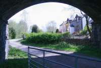 View east along the trackbed of <I>The Port Road</I> towards Dumfries from below the road bridge at the west end of the former New Galloway station. The line ran straight ahead through the shrubbery with the much modified station building (now a private residence) standing on the right. The remains of the platforms can still be seen looking back from the other end of the site beyond what is now a private garden. Photographed on 12 May 2010.<br><br>[John Furnevel 12/05/2010]