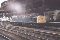 <I>Whistle while you wait.</I> An early EE Class 40, 40008, idles on the centre roads at Manchester Victoria between banking duties. When Victoria was rebuilt the trainshed was demolished and new platforms built. This view was taken from what is now Platform 3, the old through platform to Exchange station. The lines on which the loco is standing are now covered by the new Platforms 4 and 5, [See image 29761] with the Manchester Arena above. <br><br>[Mark Bartlett 26/08/1982]