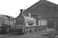With various components already removed, one of the attractive W Worsdell J25 0-6-0s, no 65695, still carrying its 52H Tyne Dock shed plate, awaits its fate in the yard at Darlington Works in the early 1960s.<br><br>[K A Gray //]
