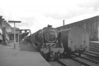 Royal Scot 4-6-0 no 46115 <I>Scots Guardsman</I> at Carlisle platform 1 with the 1.12pm Liverpool - Glasgow Central / Edinburgh Princes Street in July 1965. The locomotive was withdrawn from 12A on 1 January 1966 and has since been preserved.<br><br>[K A Gray 31/07/1965]