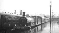 The preserved ex-Highland Railway Jones Goods 4-6-0 no 103 stands in the rain at Inverness in August 1965 with one of the specials run in connection with the Highland Railway centenary celebrations.<br><br>[K A Gray /08/1965]