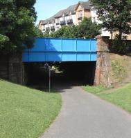 The course of the CR's Leith New Lines under Craighall Road, Newhaven, looking towards Newhaven Junction. Platforms were built here for a station. They are presumably still there, under the earth <br>
bulldozed into the cutting after the line closed in 1968. Like the two other would-be stations on this line they were never opened and the line saw no passengers in its 65-year life. The (then) existing CR Newhaven station was just a little along Craighall Road: too close to be a separate station, yet too far apart, with no connecton but the road, to be the same one. I wonder what their intention was on this? <br>
<br><br>[David Panton 12/07/2010]