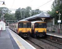 Standing obligingly in sequential order at Milngavie on 14 July are 318 264 and 318 265. 264 has recently arrived form Bellgrove.Oddly perhaps the return workings are to High Street, one stop short. I could be wrong, but I doubt these workings will survive intact when the timetable is redrawn for December and the Airdrie - Bathgate reopening. At Platform 1 265 is preparing to depart with a Motherwell service. Platform 1: Argyle Line, Platform 2: North Clyde Line is the usual arrangement, with trains departing every 15 minutes in turn.<br><br>[David Panton 14/07/2010]