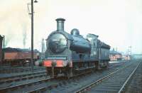 View east showing J36 no 65235 <I>Gough</I> standing on Haymarket shed in March 1959 (temporarily nameless). Spanning the tracks in the right background is the bridge carrying the Caledonian suburban line, with Coltbridge Junction signal box visible on the embankment.<br><br>[A Snapper (Courtesy Bruce McCartney) 28/03/1959]