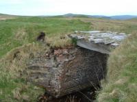 A bridge (over the Burnhead Burn) on the Benwhat line about two miles east of Drumgrange incline top on the old 'plateau' lines of the Dalmellington Iron Company above Waterside. These lines served a number of iron ore mines. The view looks to Benwhat with Lethanhill two miles west behind the camera.<br><br>[Ewan Crawford 13/06/2003]