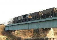 58040 <I>Cottam Power Station</I> crosses the River Calder at Broad Cut, Calder Grove, on 13 March 1993, immediately after leaving the British Oak exchange sidings.<br><br>[David Pesterfield 13/03/1993]