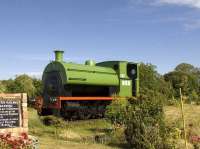 A Peckett 0-4-0 tank engine at Beal level crossing on the site of the former station (closed in 1968), along with other railway memorabilia.<br><br>[Graham Morgan 07/07/2010]