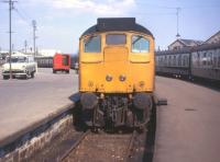 The unusual sight of a locomotive at the buffer stop side of passenger coaches at Platform 5/6 of Inverness station in the summer 1972. Normally trains from the Far North and Kyle ran round the Rose Street curve and propelled their trains into Platforms 1-4. <br>
<br><br>[David Spaven //1972]