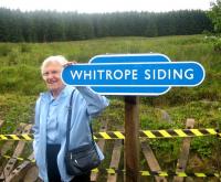 A name closely associated with the Waverley Route, Madge Elliot, who campaigned vociferously against closure at the time and who has been ceaseless in her efforts since then for the return of a train service to the Borders. Madge is seen here at the WRHA open weekend at Whitrope on 18 July 2010.<br><br>[Bruce McCartney 18/07/2010]