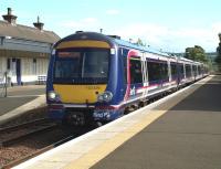 A 5 car 170 train for Dundee, lengthened from the normal 3-car set due to the Open Golf Championship at St Andrews, calls at Ladybank on 17 July 2010.<br><br>[Brian Forbes 17/07/2010]