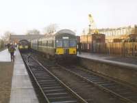 Last day of passenger services at Corstorphine on 30 December 1967, although there still seems to be plenty of activity in the adjoining goods yard. On the right is the last train from Corstorphine, the 13.36 (SO) to Edinburgh Waverley, comprising 2 mixed-livery Metro-Cammell 2-car sets.  This had arrived as the 13.06 (SO) from Waverley, the usual 2-car set having been strengthened with an additional set for the occasion.  On the left is the last through train from Corstorphine to North Berwick, consisting of a Gloucester RC&W 2-car set timed to leave at 13.24.<br><br>[Jim Peebles 30/12/1967]