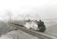 The 16.22 (SX) Bishopton - Glasgow Central leaves Bishopton in the spring of 1967 behind 73059. This was the Royal Ordnance Factory workmen's train. The stock arrived as ECS and lay over in a siding until departure time. The train stopped only at Paisley St James and Gilmour Street, arriving at Glasgow Central at 16.47. It ceased when electric services commenced.<br>
<br><br>[Colin Miller //1967]