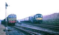 The last freight from Kelso held at Kelso Junction on 29 March 1968 while a northbound train passes on the Waverley route. Locomotive D3891 is carrying the unofficial <I>Kelso Lad</I> headboard [see image 22937].   <br><br>[Bruce McCartney 29/03/1968]