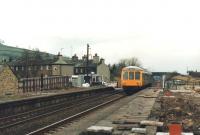 Reopening works taking place at Cononley Station, near Skipton, in 1988 as a first generation DMU heads towards Leeds. Note the crossing cabin at the end of the platform to the left of the DMU. Originally opened in 1847, Cononley station closed to passengers in 1965 but was reopened on 20 April 1988, less than a month after this photograph was taken.<br><br>[David Pesterfield 22/03/1988]