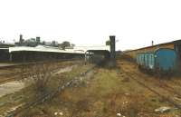 Long unused and disconnected from the rail network, Wolverhampton Low Level Station is seen here looking west from Sun Street towards Oxley in February 1997. Following closure to passengers in early 1972 [see image 28115] the station had been converted for use as a parcels depot and later provided accommodation for the Divisional Engineering staff.  The listed main station building is now earmarked to become part of a mixed retail and residential development.<br><br>[David Pesterfield 03/02/1997]