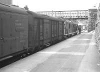 An Inverness train about to depart Kyle of Lochalsh behind a Sulzer Type 2 in July 1963.<br>
<br><br>[Colin Miller /07/1963]