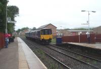 Northern Sprinter 150143 approaches Whalley from Clitheroe on a Manchester Victoria service. Behind the train is the Sidings Business Park that occupies the old goods yard. Sixteen years after re-opening the Ribble Valley line continues to enjoy good levels of passenger use and is now officially a Community Railway. <br><br>[Mark Bartlett 21/07/2010]