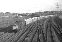 Clayton D8614 comes off the line from Niddrie North at PortobelloEast Junction in February 1970 with empty Leith General Warehousing grain wagonsreturning from the North British Distillery at Gorgie to Leith. Thisand the outward working were amongst the highlights of an afternoon'sphotography on the Sub around that time. <br><br>[Bill Jamieson 25/02/1970]