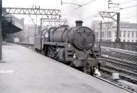 A grimey and unidentifiable Standard class 5 arrives at Glasgow Central light engine from Polmadie to pick up a Gourock train in February 1967.<br>
<br><br>[Colin Miller /02/1967]