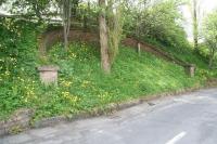 The infilled bridge on Tweed Avenue, Peebles, part of an embankment on the route that once carried the 1864 line linking North British and Caledonian territory within the town. The NB yard and station stood a quarter of a mile off to the left and the Tweed railway bridge a short distance to the right [see image 29949]. The link line was closed to traffic in 1959. View south east on 21 May 2010. <br><br>[John Furnevel 21/05/2010]