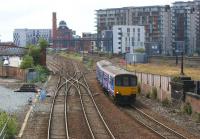 150133 approaching Manchester Victoria from the west on 17 July 2010, with a service from Clitheroe via Blackburn and Bolton. The footbridge of the former Manchester Exchange station can be seen on the left of the photograph. <br>
<br><br>[John McIntyre 17/07/2010]