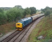 EE Type 3 37215 brings up the rear on a service leaving Winchcombe for Gotherington where G&WR services are temporarily terminating whilst a landslip is dealt with. The locomotive is in excellent condition and, apart from looking a little <I>ex works</I>, is just how I remember the Class 37s when in regular service [See image 29977].<br><br>[Mark Bartlett 17/07/2010]