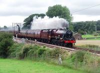 <I>The Fellsman</I> excursions can be hauled by any one of a pool of four Carnforth based steam locomotives and the first of the 2010 summer trains was taken by 5690 <I>Leander</I>. It is seen here on the first leg of its journey at Oubeck, just south of Lancaster. Perhaps because of recent failures of other steam locomotives Brush Type 4 no 47760 was tagged on the rear - something not seen on any of the 2009 trains. <br><br>[Mark Bartlett 28/07/2010]