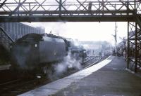 Standard class 5 4-6-0 no 73069 stands on the south western section of the Earlestown triangle on 23 June 1968. The locomotive is about to take over the LCGB <I>Two Cities Limited</I> railtour from Stanier 8F no 48033, which it will then take forward, via a roundabout route, on the next leg to Manchester Victoria. [See image 25335]<br><br>[Robin Barbour Collection (Courtesy Bruce McCartney) 23/06/1968]