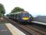On 30 May 170 416 approaches the Up platform at Kinghorn with a service for, unusually, Dunfermline Town. The Forth Bridge line has been closed on Sundays in May for engineering work so services are using the north to east curve at Inverkeithing thus avoiding Inverkeithing station.Passengers for Edinburgh are bussed from Dalgety Bay. Out on the Firth of Forth a vessel (one of eight) waits its turn to go up river. Below decks there are no doubt swarthy men in greasy vests playing cards.<br><br>[David Panton 30/05/2010]
