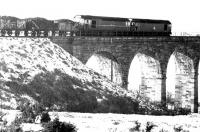 A coal train from Waterside runs out onto Burnton Viaduct on 1 December 1971 on its way to Ayr Harbour.<br><br>[John Furnevel 01/12/1971]