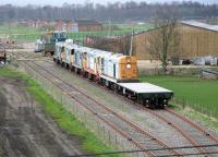 Privately stored class 20s at the former MoD Base Ammunition Depot, Smalmstown, in March 2005. The lines in the foreground pass under the road to link with the larger MoD Longtown, directly behind the camera. Once part of the enormous complex that was the wartime <I>'HM Factory Gretna'</I> stretching west as far as Eastriggs on the other side of the border.  <br><br>[John Furnevel 10/03/2005]