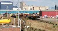 Pipes in the south sidings at Leith South yard on 11 April 2005. The pipes had been produced in Hartlepool and were coated at Leith prior to use in the North Sea gas/oil industry.<br><br>[John Furnevel 11/04/2005]