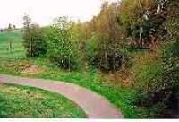 The possible site of Sheriffhall Station looking towards Millerhill and Edinburgh. The original alignment was to the left of the view here with a tight almost right angle bend on the route later eased by the North British on conversion to a railway.<br><br>[Ewan Crawford //1997]