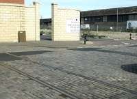 Remains of the level crossing in Salamander Place, looking north west in April 2004 as new flats take over the area. The former Caledonian Leith East goods depot (closed 1973) stood off camera to the right [see image 35359]. The cleared site has been acquired for redevelopment.<br><br>[John Furnevel 28/04/2004]