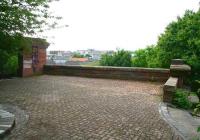 Looking SE from the abutment in Gosford Place at former Caley route 1 to Leith East and the docks. The two circular columns which supported the bridge still stand beyond the parapet [see image 2196].<br><br>[John Furnevel 10/03/2003]