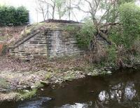 Bridge remains on the south side of the Water of Leith at Bonnington in April 1964. The bridge once carried the goods link that left the North Leith branch just east of Bonnington station to serve the industrial area south of West Bowling Green Street. [See image 3196]<br><br>[John Furnevel 28/04/2004]