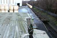 Partially loaded Binliner containers at Powderhall in January 2003. The containers in the distance at the rear of the train are standing on the bridge over the Water of Leith. <br><br>[John Furnevel 12/01/2003]