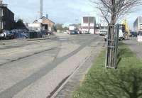 Looking west across Lower Granton Road in April 2002 at the clearly defined route of the Caley line as it curved past the former Caledonian goods shed and climbed towards Granton gasworks (indicated by the gasholder in the left background).<br><br>[John Furnevel 27/04/2002]