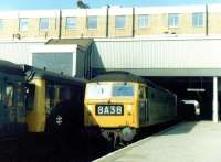 An eastbound freight passing through Ealing Broadway on 2 September 1970 on its way to join the North London Line at Acton Wells Junction. The locomotive is Stratford based Brush Type 4 no 1563 and the freight is passing the Greenford branch DMU awaiting its departure time at the adjacent platform.<br><br>[John Furnevel 02/09/1970]