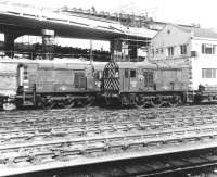 Grab shot from a passing Hammersmith & City Line train between Royal Oak and Paddington in December 1968 showing D3756 and D3761 on the north side of the line. Both locomotives were involved in transporting materials in connection with construction of the elevated 'Westway' section of the A40, part of which can be seen in the picture.<br><br>[John Furnevel 04/12/1968]