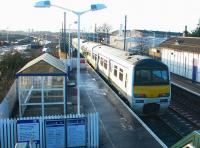 A North Berwick - Waverley train calls at Prestonpans station on 29 January 2003. In the left background major works are underway in connection with realignment of the ECML due to recent subsidence problems in the area.<br><br>[John Furnevel 29/01/2003]