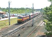 A train to North Berwick passing Portobello in June 2004. The locomotive propelling the train is EWS 90026.<br><br>[John Furnevel 17/06/2004]