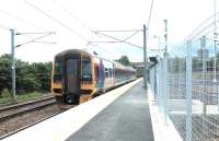 Platform scene at Newcraighall on 4 June 2002, the first day of operations, as ScotRail 158714, with a recently terminated service from Bathgate, prepares to run forward to the reversing siding at the north end of Millerhill yard.<br><br>[John Furnevel 04/06/2002]